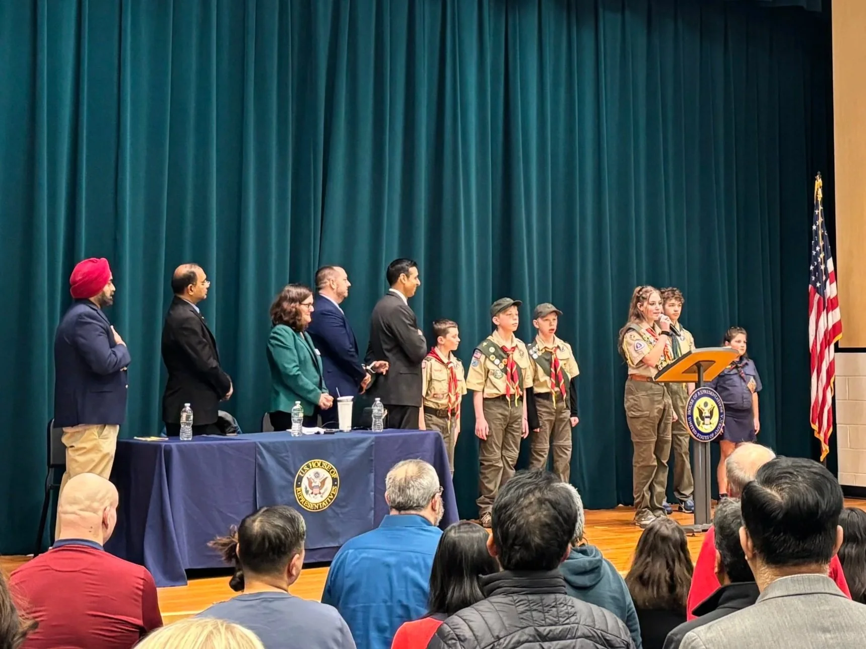 Speakers and attendees at a community event